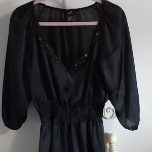 Black color blouse with beautiful beading .